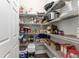 Walk-in pantry with ample shelving for organized storage at 7839 Sw 97Th Cir, Ocala, FL 34481