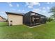 Inviting screened patio with outdoor seating, seamlessly blending indoor and outdoor living in a private backyard at 7839 Sw 97Th Cir, Ocala, FL 34481