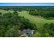 Stunning aerial view showcasing lush green golf course with a beautiful home nestled among the trees at 7961 Midway Drive Ter # J102, Ocala, FL 34472