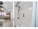 Modern bathroom features a shower and bath with white marble tiling at 7961 Midway Drive Ter # J102, Ocala, FL 34472