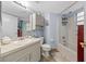 Bathroom featuring a shower and bath, toilet, vanity, and coordinated decor at 7961 Midway Drive Ter # J102, Ocala, FL 34472