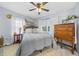 Bright bedroom with ceiling fan, hardwood floors, and lots of natural light at 7961 Midway Drive Ter # J102, Ocala, FL 34472
