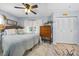Bedroom with ceiling fan, closet, hardwood floors, and double hung windows at 7961 Midway Drive Ter # J102, Ocala, FL 34472