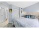 Cozy bedroom featuring a well-made bed, light blue walls, and closet space at 7961 Midway Drive Ter # J102, Ocala, FL 34472