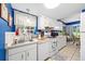 Efficient kitchen with white appliances and a sink overlooking the yard allows for a bright workspace at 7961 Midway Drive Ter # J102, Ocala, FL 34472