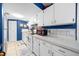 Well-lit kitchen with white appliances and plenty of counter space create an efficient cooking area at 7961 Midway Drive Ter # J102, Ocala, FL 34472