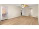 Spacious bedroom featuring wood floors, ceiling fan, and lots of natural light at 8034 Sw 81St Loop, Ocala, FL 34476