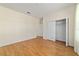 Bedroom featuring wood floors, a sliding closet, and natural lighting at 8611 Sw 83Rd Loop, Ocala, FL 34481
