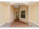 Covered front entry features brick pavers and stone accents for a welcoming appeal at 8611 Sw 83Rd Loop, Ocala, FL 34481