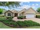 Charming home with a brick walkway, stone accents, and well-maintained landscaping at 8611 Sw 83Rd Loop, Ocala, FL 34481