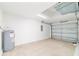 Spacious garage with an open door and modern water heater at 87 Redwood Rd, Ocala, FL 34472