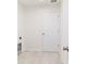 Clean laundry room with wood-look flooring and utility connections at 87 Redwood Rd, Ocala, FL 34472