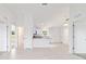 Bright living room with an open floor plan, white walls and flooring, and lots of natural light at 87 Redwood Rd, Ocala, FL 34472