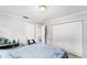 Clean and bright bedroom featuring tile flooring, ample closet space, and neutral walls for a versatile living space at 8940 Se 87Th Ter, Ocala, FL 34472