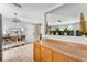 Comfortable living space with light-colored walls and tile flooring, with wooden cabinets providing ample storage at 8940 Se 87Th Ter, Ocala, FL 34472