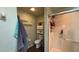 Updated bathroom featuring modern fixtures, tile flooring, and glass door shower at 9490 Sw 94Th Ct, Ocala, FL 34481