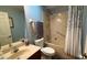Cozy bathroom featuring a bathtub, shower, neutral tile, and blue painted walls at 9490 Sw 94Th Ct, Ocala, FL 34481
