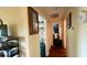 View of a hallway leading to various rooms, offering storage and a glimpse of the home's layout at 9490 Sw 94Th Ct, Ocala, FL 34481