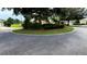 Street view shows a manicured traffic island with well maintained landscaping at 9490 Sw 94Th Ct, Ocala, FL 34481