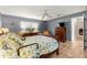 Comfortable bedroom with ample natural light, neutral walls, and a ceiling fan at 9587 Sw 84Th Ter # E, Ocala, FL 34481