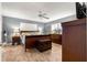 Cozy bedroom with a sleigh bed, tiled floors, and ample closet space at 9587 Sw 84Th Ter # E, Ocala, FL 34481