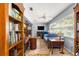 Bright living room with large windows, tile floors, blue sofa, and lots of natural light at 9587 Sw 84Th Ter # E, Ocala, FL 34481