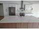 Modern kitchen featuring new appliances, island with sink, and lots of storage at 9721 Bahia Rd, Ocala, FL 34472