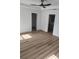 Bright main bedroom with modern flooring, neutral walls, ceiling fan and easy access to bathroom at 9721 Bahia Rd, Ocala, FL 34472