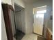 Bright bathroom featuring an enclosed shower and a linen closet at 9730 Sw 90Th St, Ocala, FL 34481