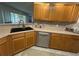 Kitchen area with light colored cabinets, stainless steel appliances, and a corner sink at 9730 Sw 90Th St, Ocala, FL 34481