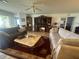 Comfortable living room with ceiling fan and built in fireplace at 9730 Sw 90Th St, Ocala, FL 34481