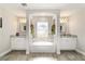 Luxurious bathroom boasts dual vanities, a soaking tub, and neutral tile, creating a spa-like retreat at 9957 Sw 45Th Ave, Ocala, FL 34476