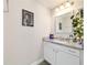 Bathroom vanity with granite countertop, tiled backsplash, and decorative accents, combining functionality with style at 9957 Sw 45Th Ave, Ocala, FL 34476