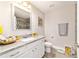 Bright bathroom with granite countertops, white vanity, and decorative accents at 9957 Sw 45Th Ave, Ocala, FL 34476