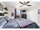 Cozy bedroom features dark furniture, closet and window at 9957 Sw 45Th Ave, Ocala, FL 34476