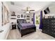 Comfortable bedroom with decorations, a ceiling fan, and a closet at 9957 Sw 45Th Ave, Ocala, FL 34476