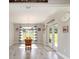 Bright breakfast nook with tile floors, large windows and glass doors, providing ample natural light at 9957 Sw 45Th Ave, Ocala, FL 34476
