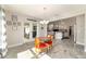 Dining area featuring tile floors, modern lighting and glass doors leading to an outdoor patio at 9957 Sw 45Th Ave, Ocala, FL 34476