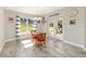 Cozy dining room with tile floors, modern lighting and access to an outdoor patio at 9957 Sw 45Th Ave, Ocala, FL 34476