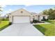 Lovely single-story home with a two car garage, beautiful landscaping and inviting curb appeal at 9957 Sw 45Th Ave, Ocala, FL 34476