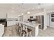 Open kitchen with granite countertops, stainless steel appliances, kitchen island seating with pendant lighting at 9957 Sw 45Th Ave, Ocala, FL 34476