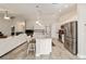 Spacious kitchen featuring a large granite island, stainless steel appliances, and open floor plan at 9957 Sw 45Th Ave, Ocala, FL 34476