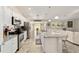 Kitchen featuring stainless appliances and granite counters with an open floor plan to dining area at 9957 Sw 45Th Ave, Ocala, FL 34476