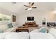 Bright living space with comfortable seating, a modern entertainment center, and inviting decor at 9957 Sw 45Th Ave, Ocala, FL 34476