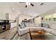Bright living room with a large sectional sofa and an open floor plan perfect for entertaining guests at 9957 Sw 45Th Ave, Ocala, FL 34476