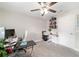 Bright office space with a ceiling fan, white walls, and a functional layout, perfect for a home workspace at 9957 Sw 45Th Ave, Ocala, FL 34476