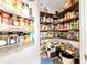 Walk-in pantry with custom shelving to allow for plenty of storage for your goods at 9957 Sw 45Th Ave, Ocala, FL 34476