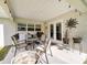 A quaint patio provides an outdoor space with BBQ grill and ample seating at 9957 Sw 45Th Ave, Ocala, FL 34476