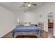 Bedroom features hardwood floors, ceiling fan, and ensuite access at 125 Placid Woods Ct, Sanford, FL 32773