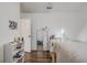 Well-lit bedroom featuring wood flooring, a full-length mirror, and an organized desk area at 125 Placid Woods Ct, Sanford, FL 32773